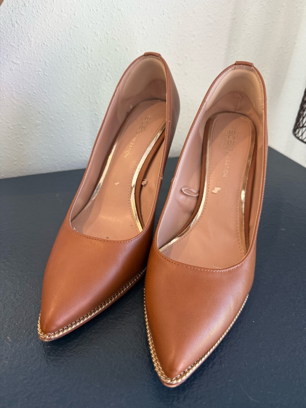 BCBGeneration Women's Brown Pointed Toe Pumps with Gold Chain Trim